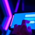Close-up of a user interacting with a glowing AI chat interface with neon accents, evoking a high-tech, intimate atmosphere.